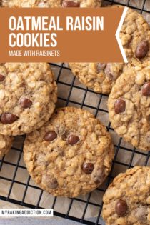 Batch of oatmeal raisin cookies with raisinets cooling on a wire rack. Text overlay includes recipe name.