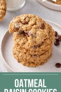 Stack of oatmeal raisin cookies on a white plate. The top cookie has a bite taken out of it. Text overlay includes recipe name.