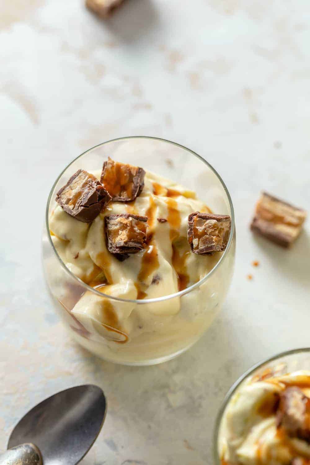 Close up of Snickers Caramel Apple Salad in a glass cup