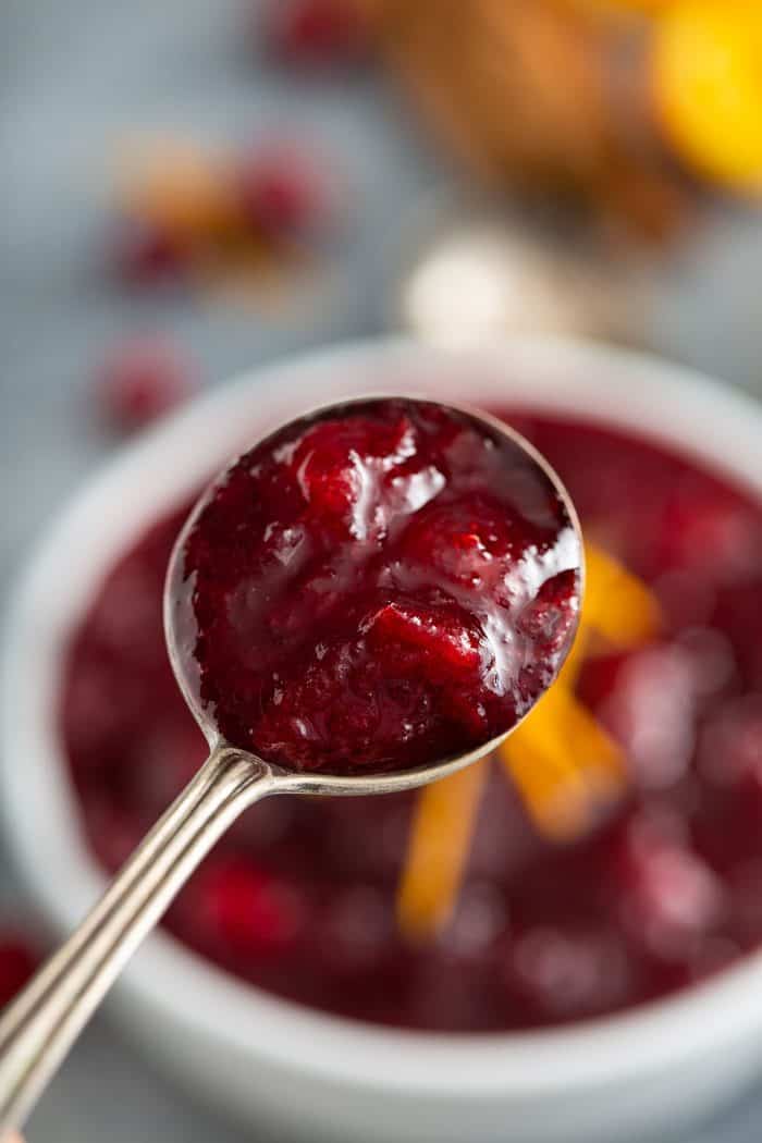 Close up of cranberry sauce on a silver spoon