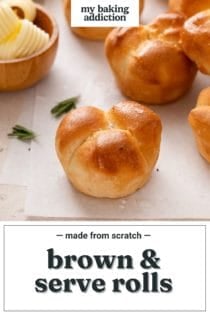 Baked cloverleaf rolls on a piece of parchment paper. Text overlay includes recipe name.