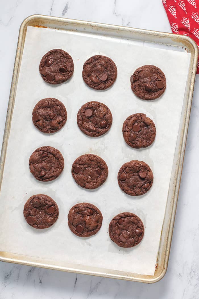 Baked mocha cookies on a parchment-lined baking sheet