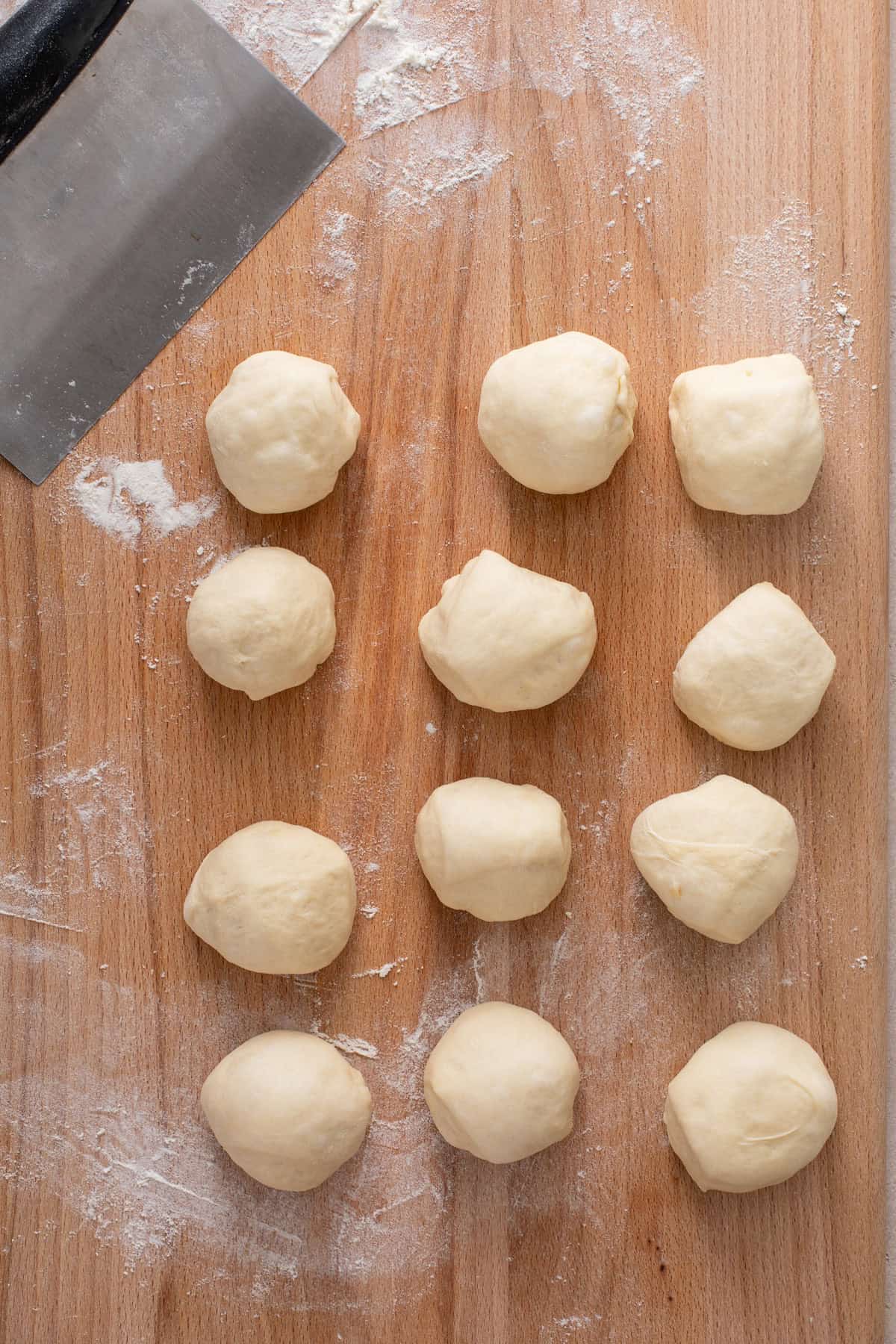 Dough cut into portions for classic dinner rolls.