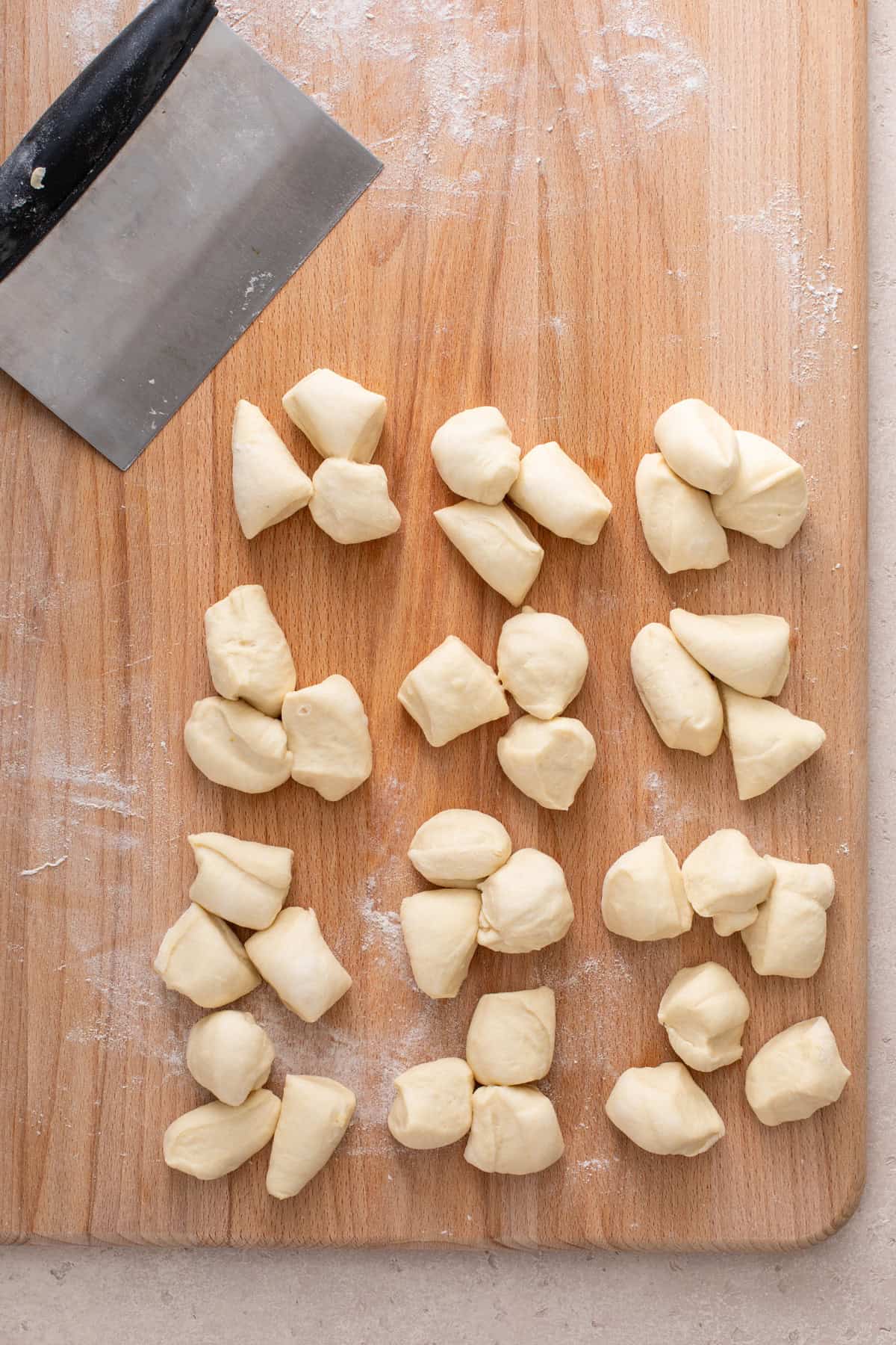 Dough cut into portions for cloverleaf rolls.