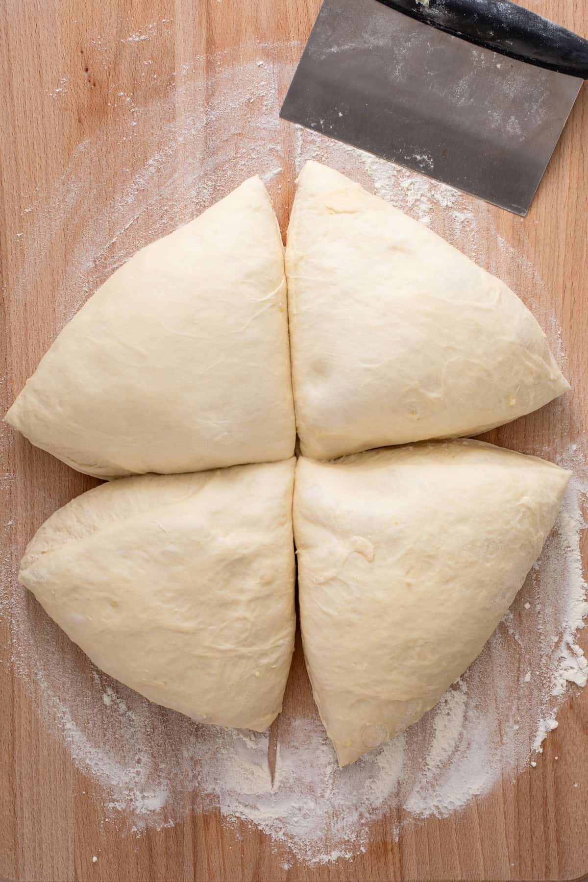 Brown and serve roll dough cut into 4 equal portions.
