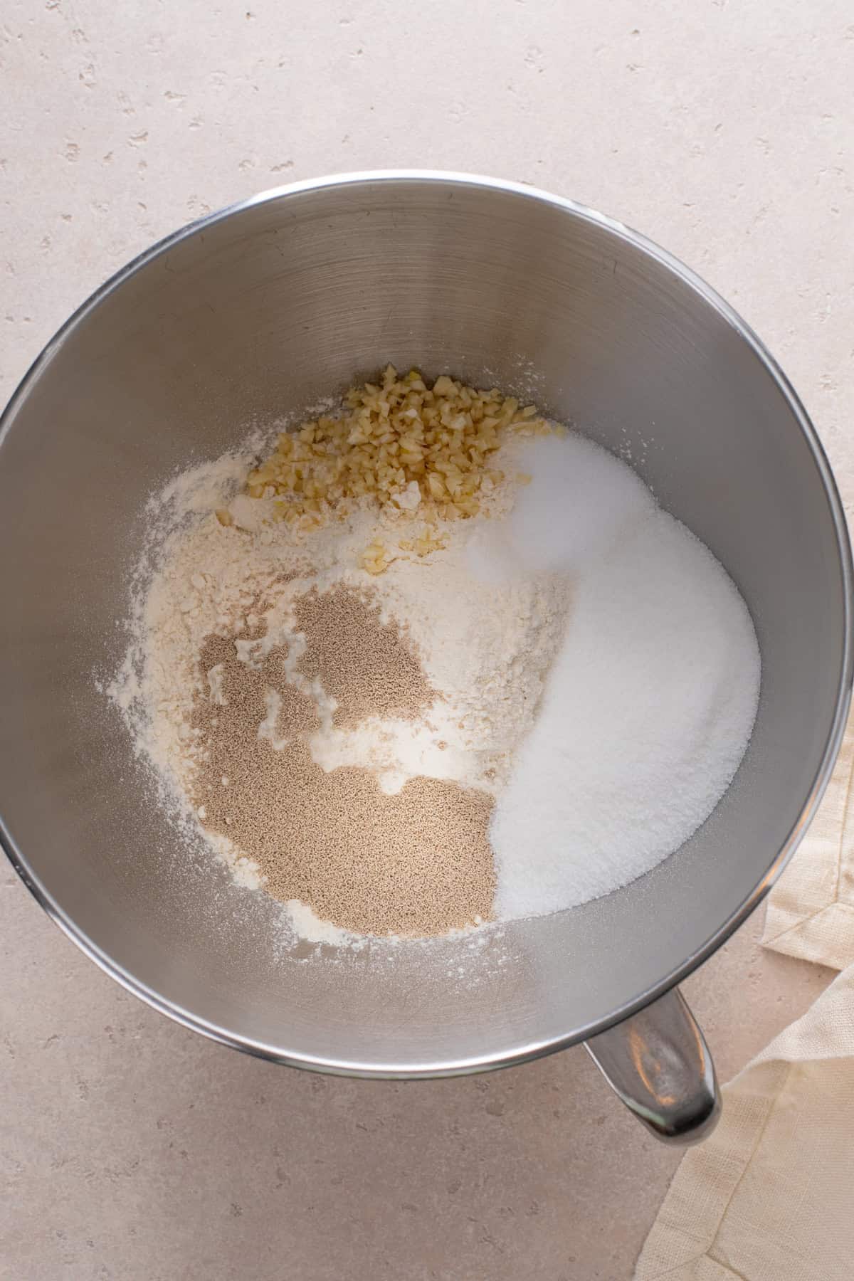 dry Ingredients for brown and serve rolls in a stand mixer bowl.