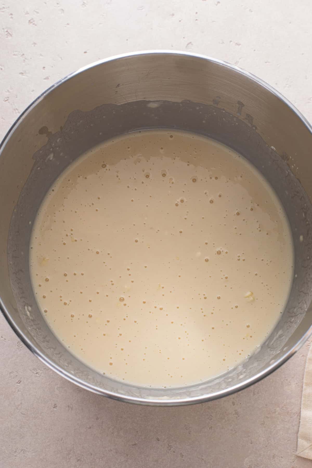 First stage of mixing brown and serve roll dough in a mixing bowl.