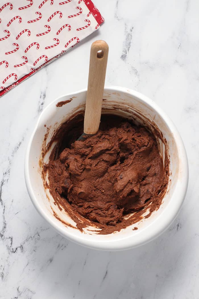 Dough for peppermint mocha cookies in a white mixing bowl