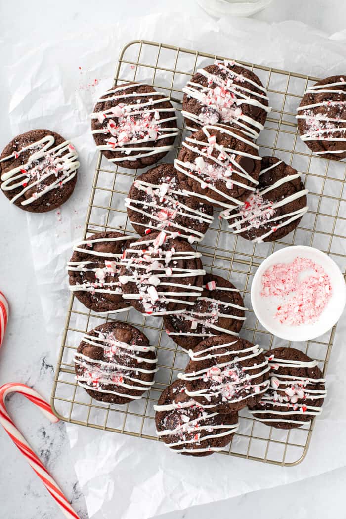 Overhead view of peppermint mocha cookies scattered on a wire cooling rack