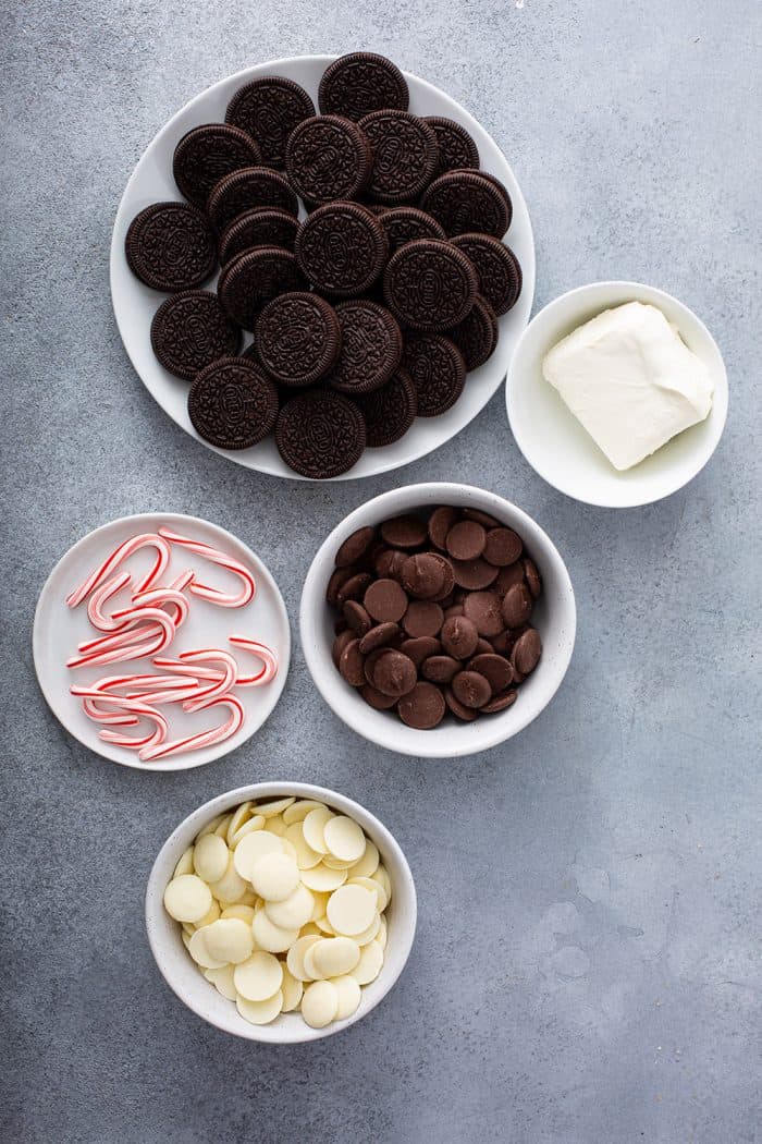 Ingredients for peppermint oreo balls arranged on a gray counter