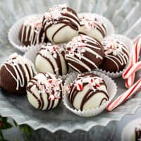 Peppermint oreo balls arranged on a metal platter