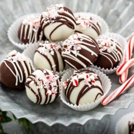 Peppermint oreo balls arranged on a metal platter