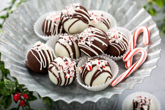 Peppermint oreo balls arranged on a metal platter