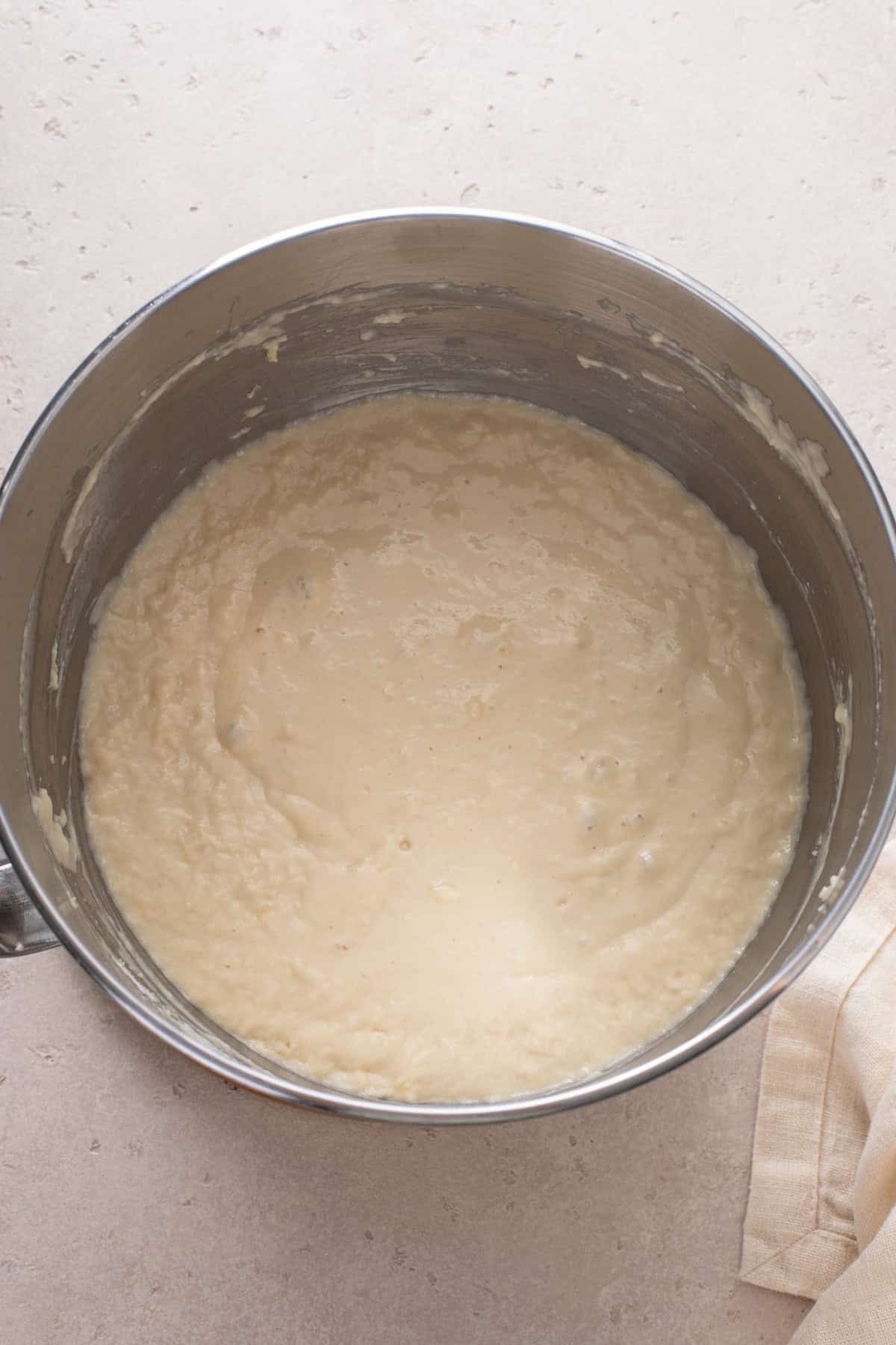 Second stage of mixing brown and serve roll dough in a mixing bowl.