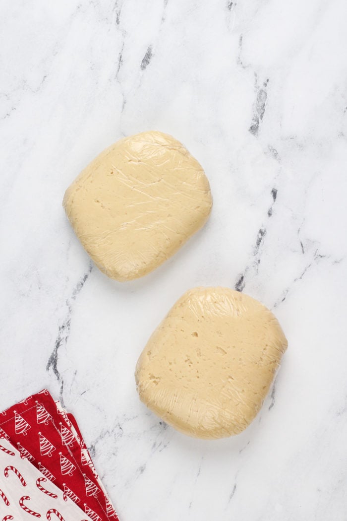 Sour cream cookie dough wrapped divided into two disks and wrapped in plastic wrap.