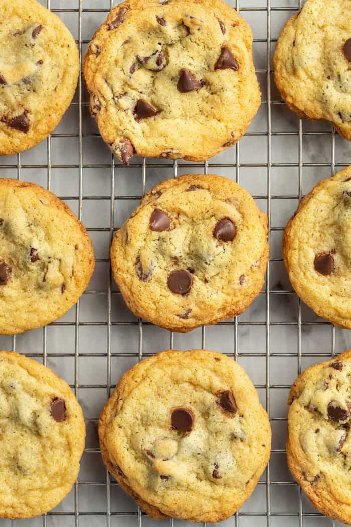 Chocolate Chip Pudding Cookies lined up on a wire rack to cool