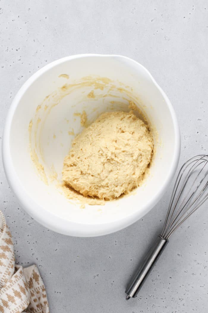 Vanilla bean scone dough in a white mixing bowl, ready to be shaped.