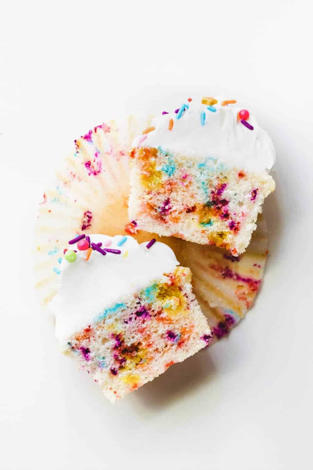 Funfetti cupcake cut in half to show the sprinkles