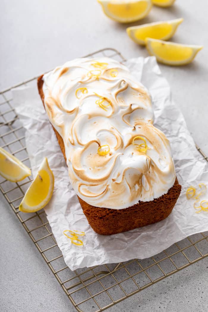 Pound cake topped with swirls of marshmallow frosting and toasted to be golden on top.