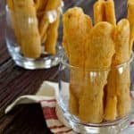 Cheese straws come together in a snap and are just perfect for just about any party. Garlic and rosemary give them a little unexpected kick.