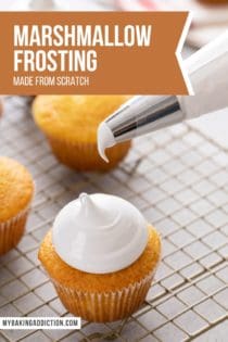 Piping bag held just above a cupcake topped with homemade marshmallow frosting. Text overlay includes recipe name.