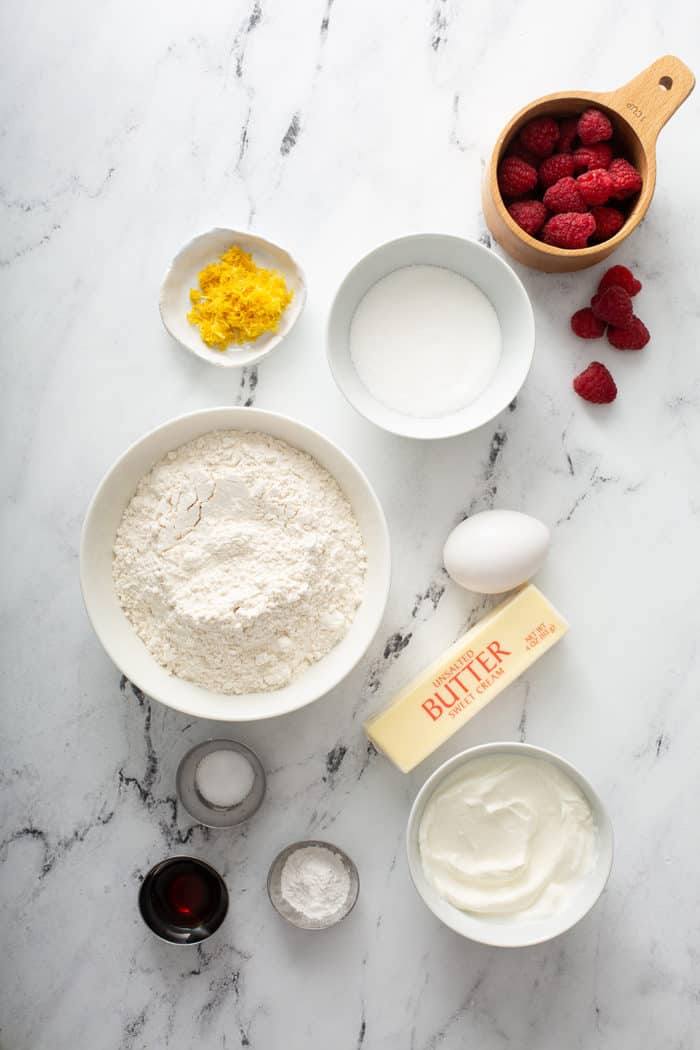 Lemon raspberry scone ingredients on a marble surface