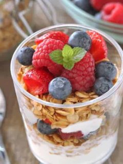 Delicious gluten-free granola pairs perfectly with fresh berries and Greek yogurt to create simple breakfast.