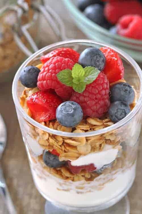 Delicious gluten-free granola pairs perfectly with fresh berries and Greek yogurt to create simple breakfast. 