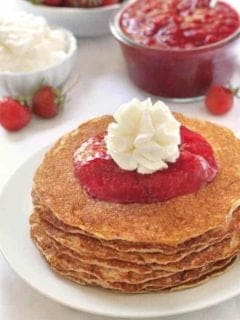 Gluten-Free Pancakes with homemade strawberry sauce and whipped cream. So good!