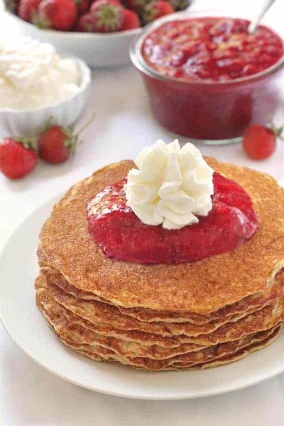 Gluten-Free Pancakes with homemade strawberry sauce and whipped cream. So good!