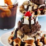 Mini waffles are topped with ice cream, toasted marshmallows and all the fixings to create the most delicious sundae.