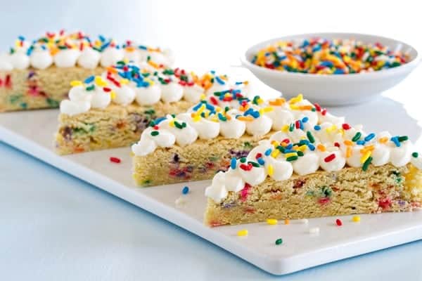 Sugar Cookie Bars Funfetti Sugar Coookie Bars are exactly the dessert to feed a crowd! Just look  all those sprinkles!