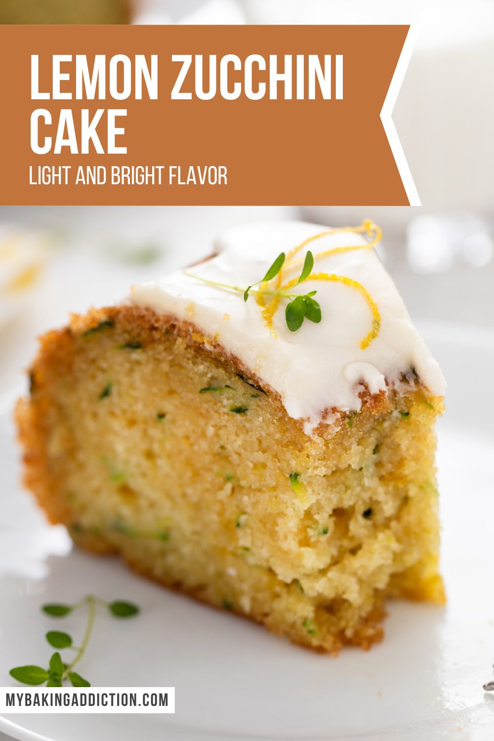 Slice of lemon zucchini cake with a bite taken from the end of it. text overlay includes recipe name.