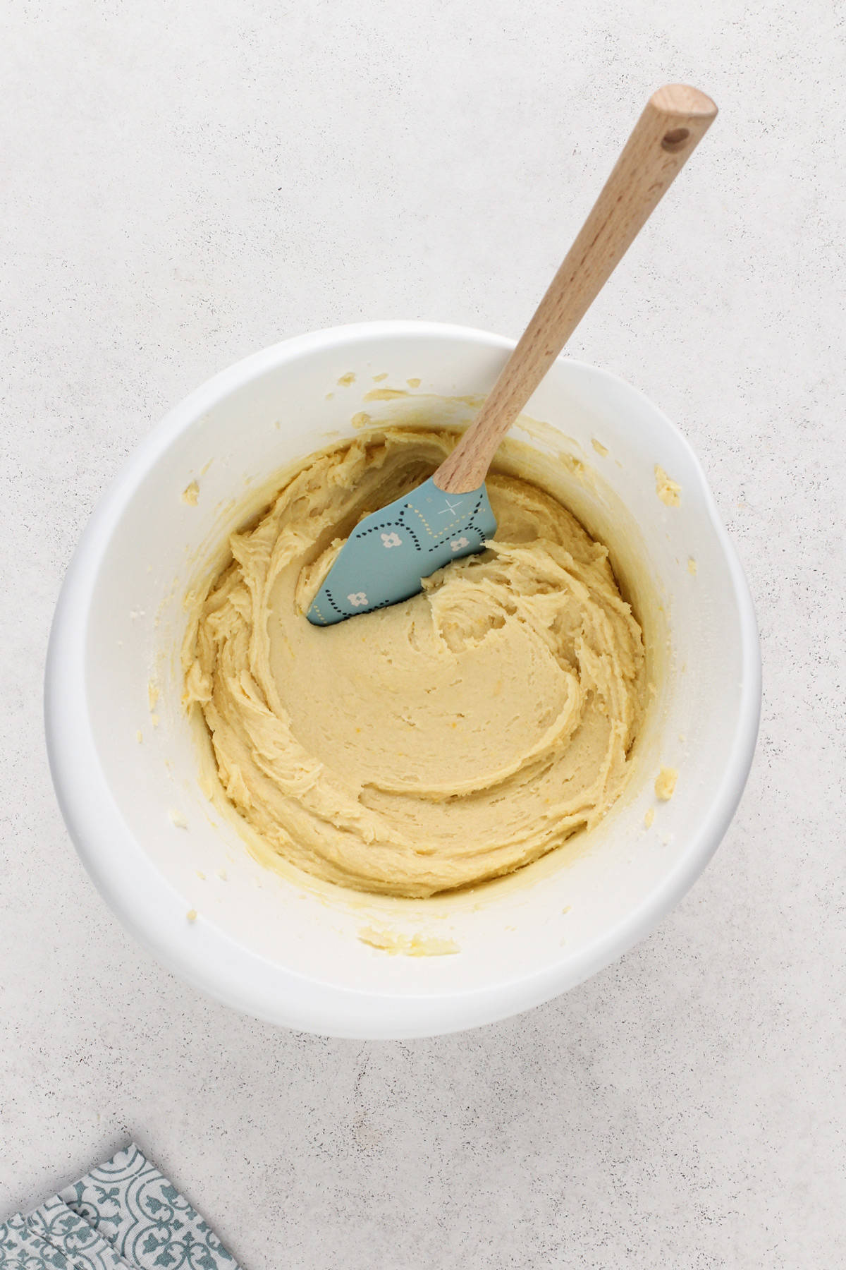 Pound cake cookie dough in a white mixing bowl.