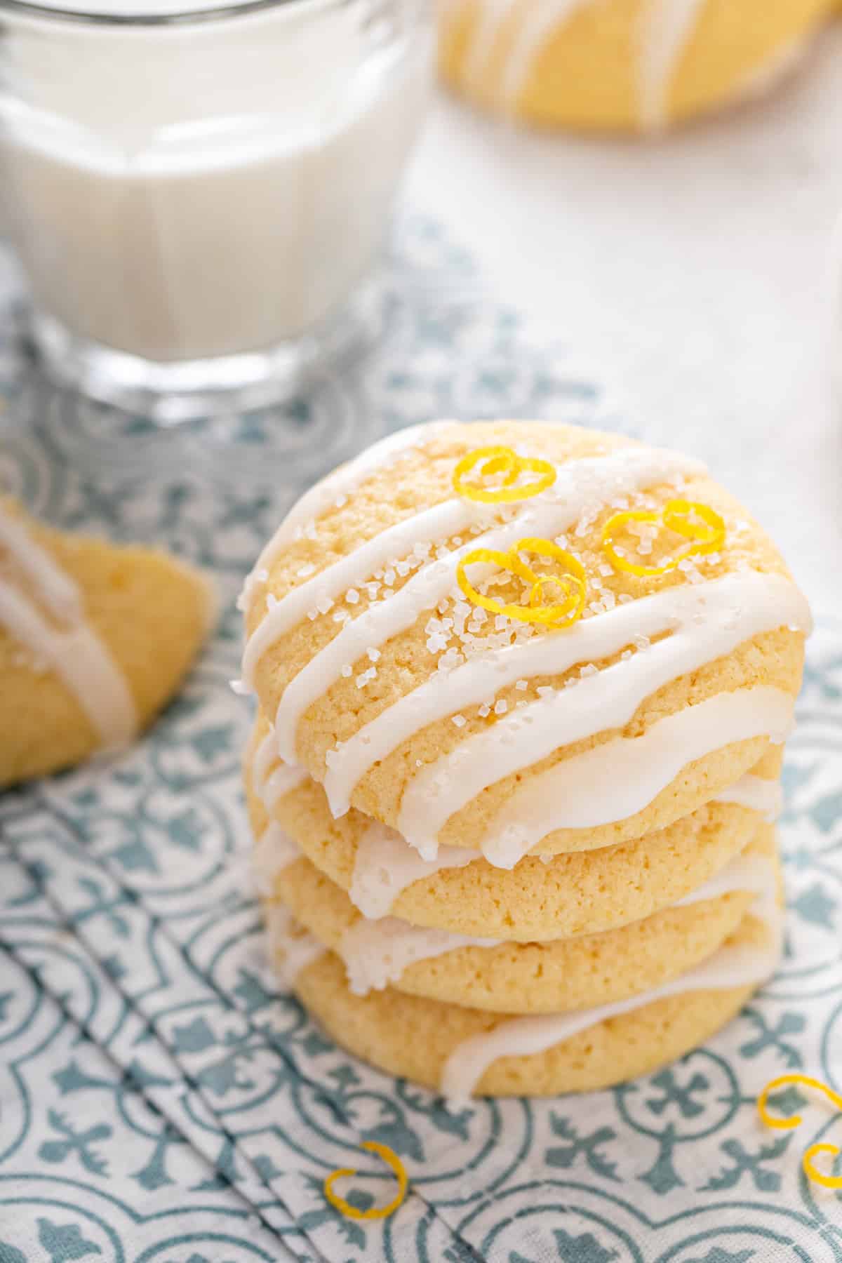 Four pound cake cookies stacked on a blue and white napkin.