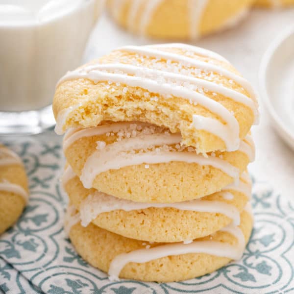 Stack of pound cake cookies on a napkin, with a bite taken from the top cookie.
