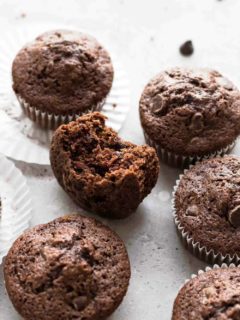 Chocolate zucchini muffin with a bite taken out of it