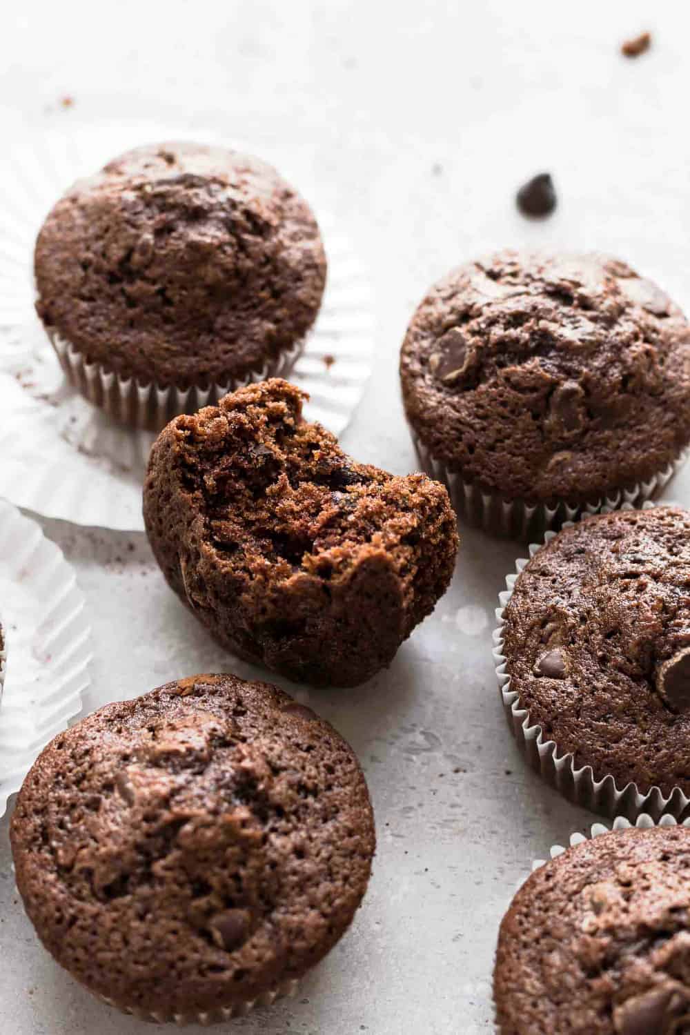 Chocolate zucchini muffin with a bite taken out of it