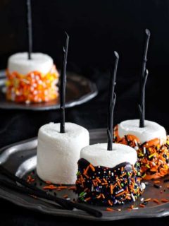 Halloween Marshmallow Pops are the handheld treat you want at your Halloween party. Colorful and delicious.