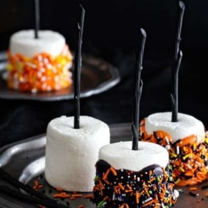 Halloween Marshmallow Pops are the handheld treat you want at your Halloween party. Colorful and delicious.