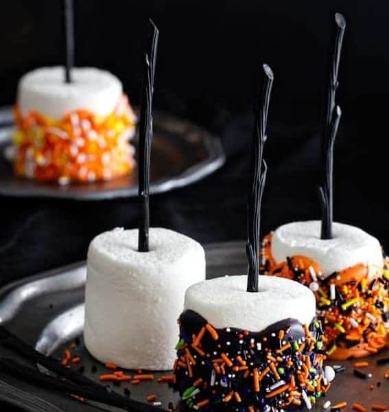 Halloween Marshmallow Pops are the handheld treat you want at your Halloween party. Colorful and delicious.