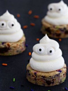 Halloween Chocolate Chip Cookies are spread with sweetly smooth buttercream. The sprinkles add the extra happy touch.