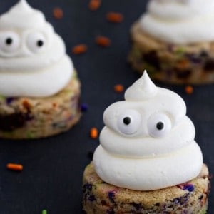 Halloween Chocolate Chip Cookies are spread with sweetly smooth buttercream. The sprinkles add the extra happy touch.