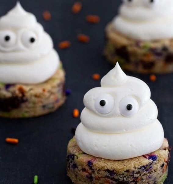 Halloween Chocolate Chip Cookies are spread with sweetly smooth buttercream. The sprinkles add the extra happy touch.
