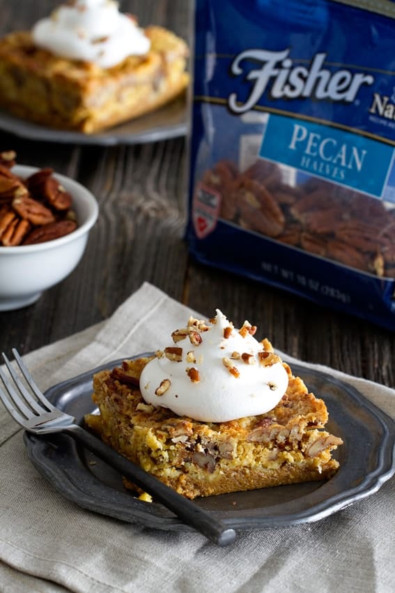 Pumpkin Crunch Cake is loaded with spices and topped with a dollop if whipped cream. It will quickly become your new favorite dessert.