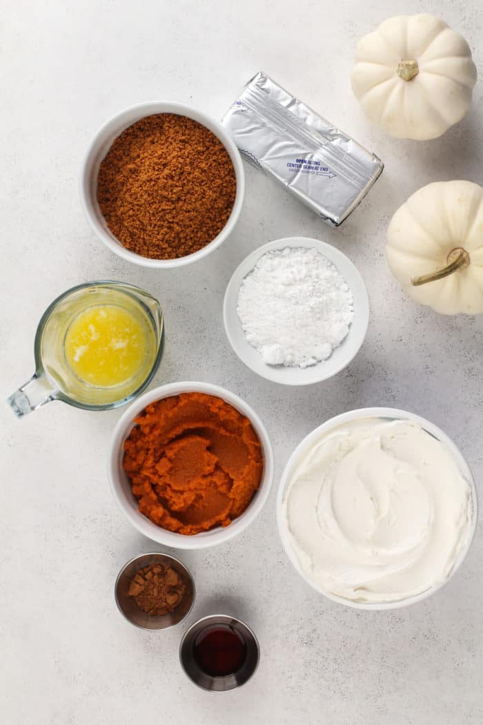 No bake pumpkin cheesecake ingredients arranged on a countertop.