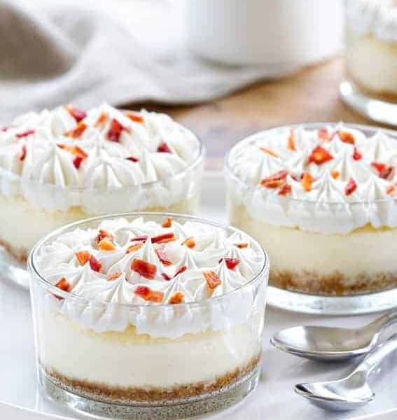 Maple Bacon Cheesecakes are the perfect sweet and salty combination. A dollop of whipped cream and candied bacon make them irresistible!