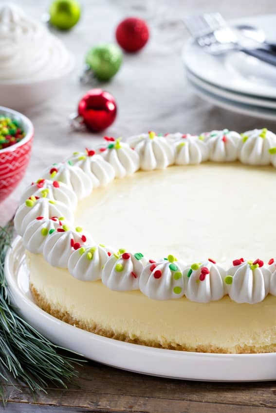 Sugar Cookie Cheesecake is going to be your new favorite holiday dessert. Festive sprinkles make it extra special!