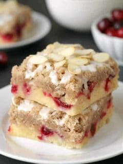 Cranberry bars with streusel and almond icing are extra special holiday dessert. Recipe includes a gluten-free option.