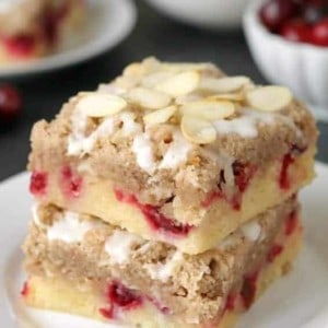 Cranberry bars with streusel and almond icing are extra special holiday dessert. Recipe includes a gluten-free option.